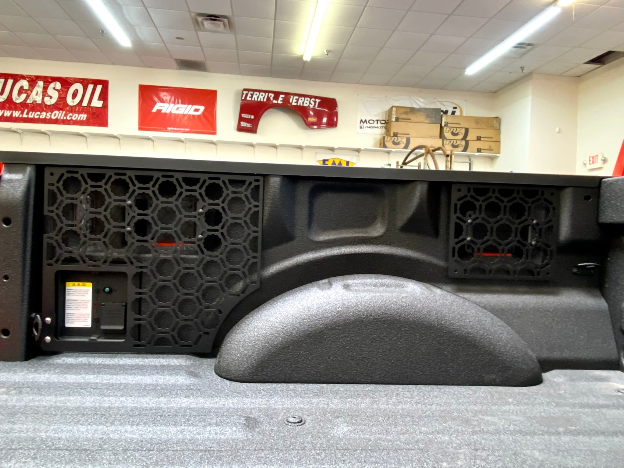 Bedside organizer panel kit for 2021-2023 Ford Raptor and F150, showcasing durable design and storage features.