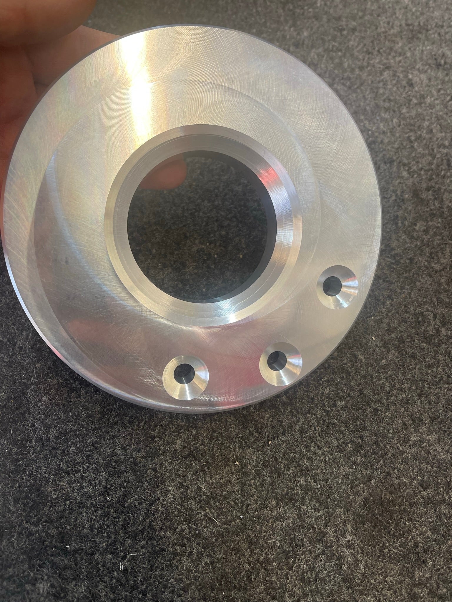 2021 and up Raptor rear spring 3/4 inch spacer lift kit by Foutz Motorsports, showcasing a precision-machined aluminum spacer.