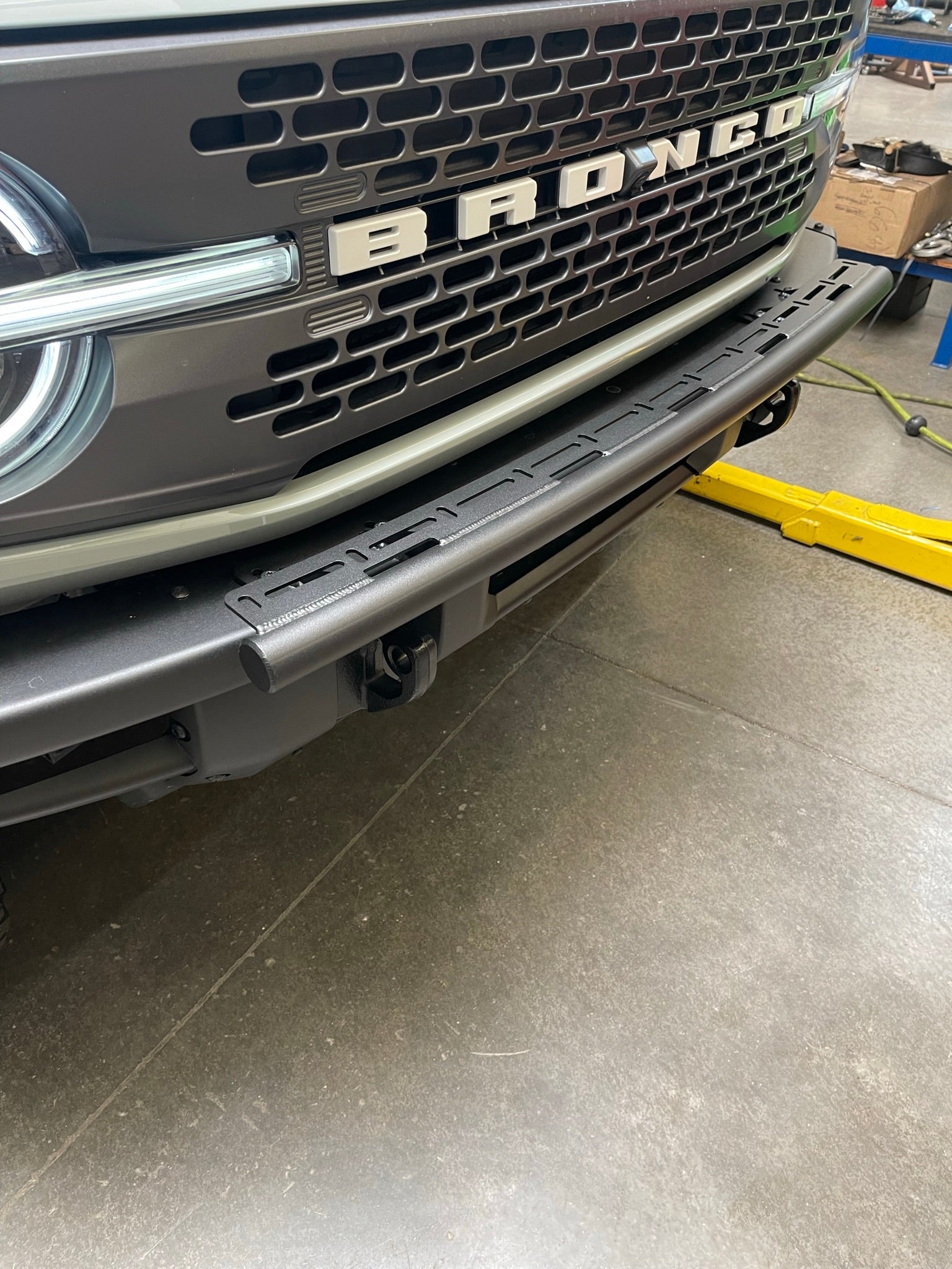 6th Gen Bronco front light mount kit installed on modular stock bumper, designed for versatile light options.