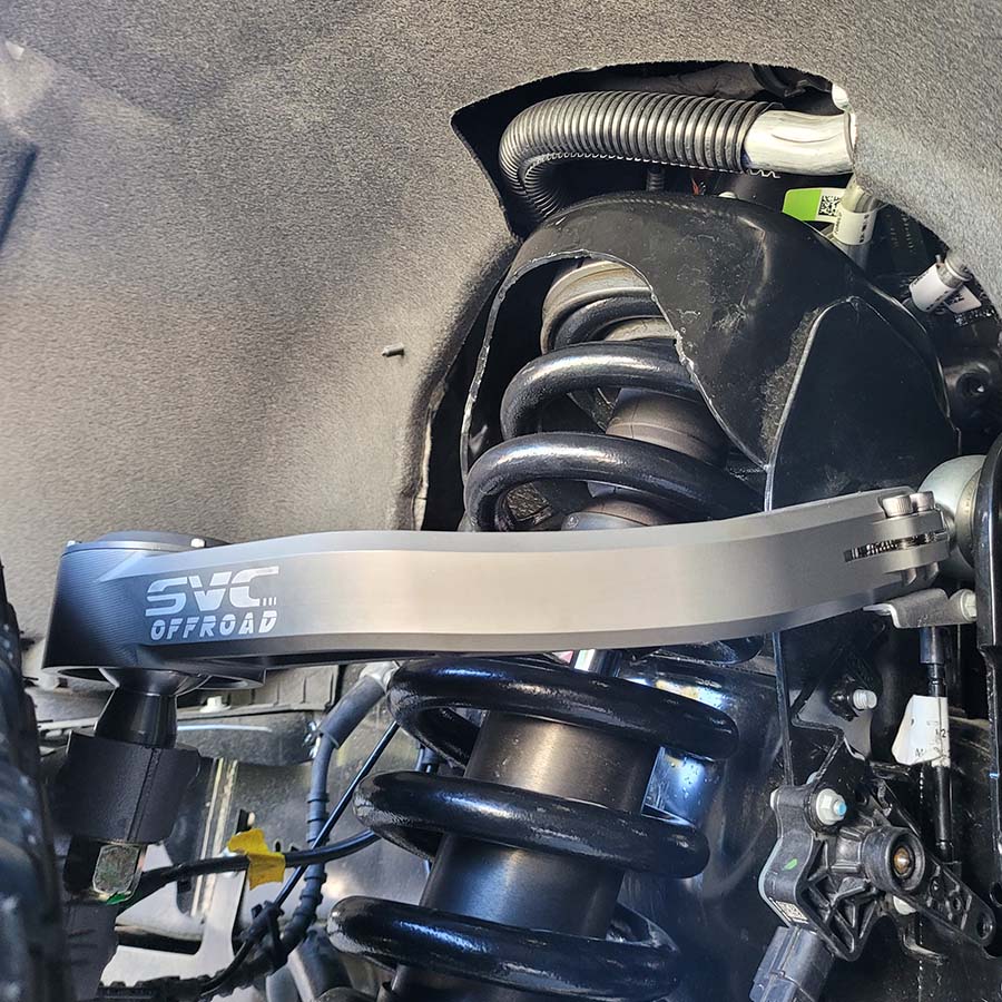 2021+ Raptor upper control arms showcasing durable construction and precise fit for enhanced off-road performance.