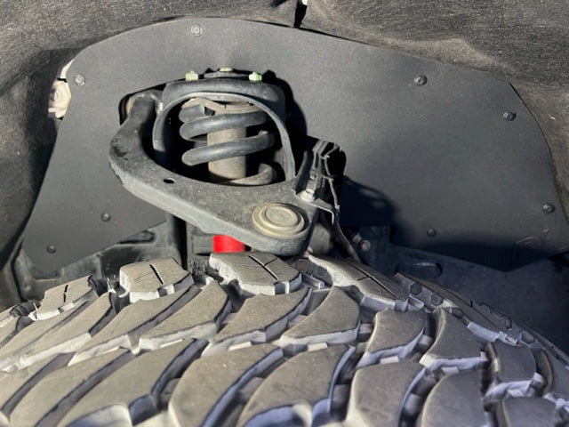 2022+ Toyota Sequoia Gen 3 splash guards installed, showcasing tire clearance and suspension components.