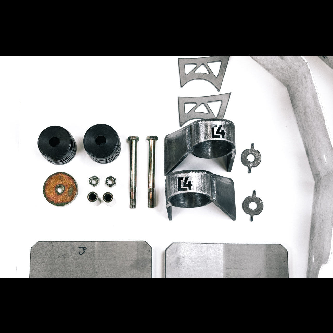 Body mount relocation kit for 3rd Gen vehicles, including brackets, bolts, and rubber mounts for enhanced offroad performance.