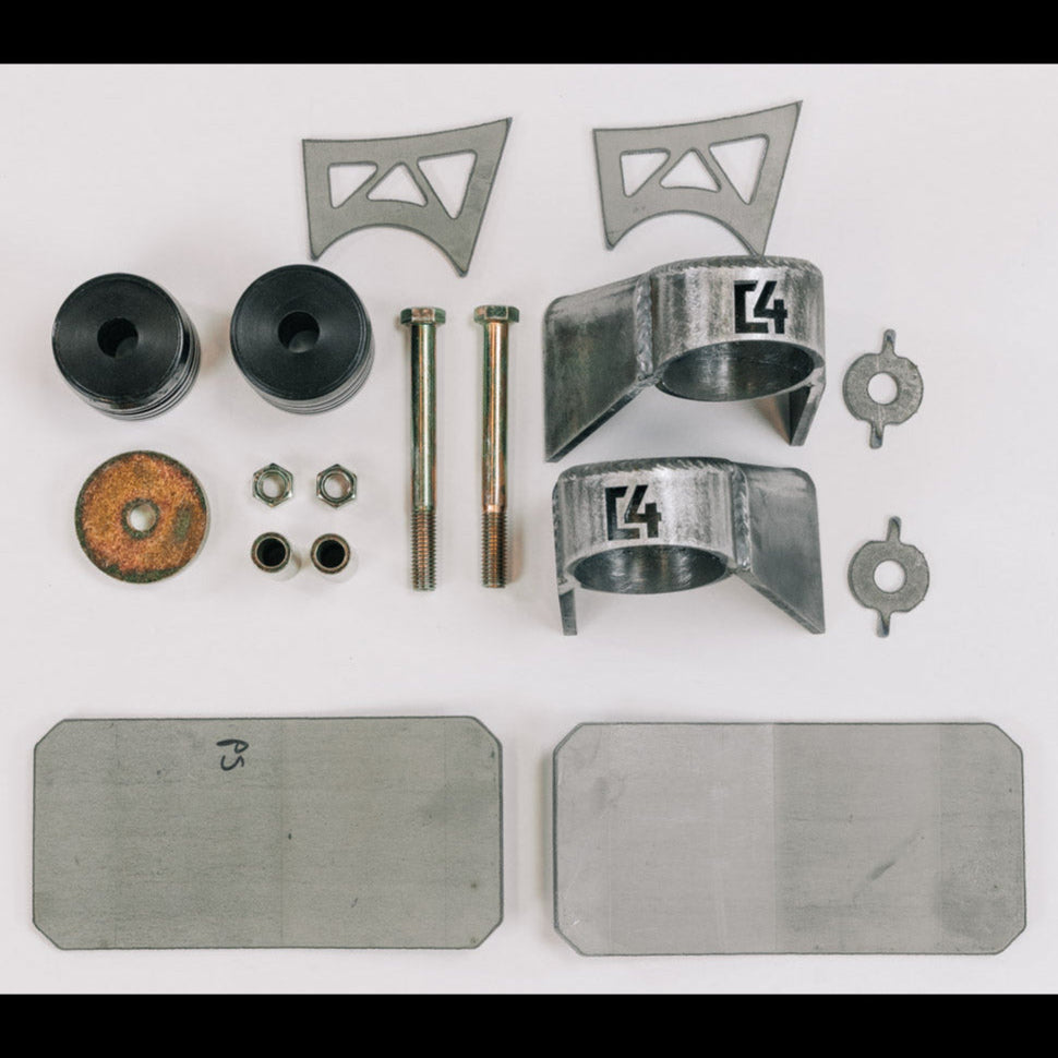 Body mount relocation kit for 2nd Gen vehicles, featuring brackets, rubber mounts, bolts, and hardware for installation.