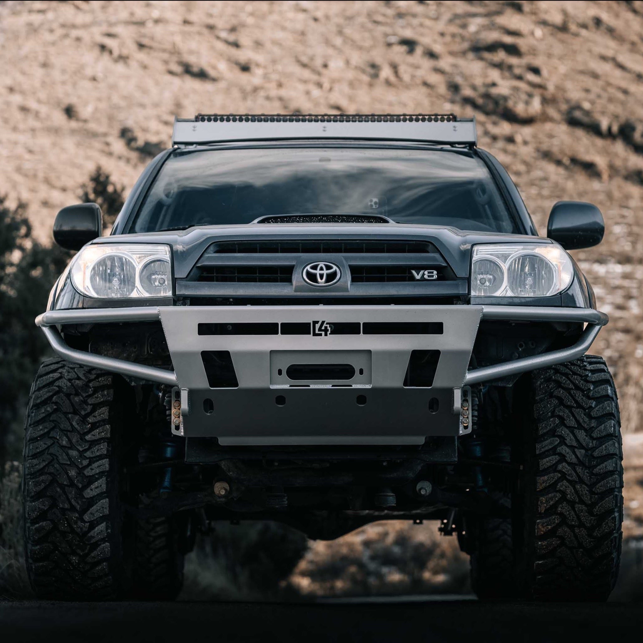 Front view of a 2003-2009 Toyota 4Runner with a hybrid front bumper, showcasing rugged off-road design and durability.