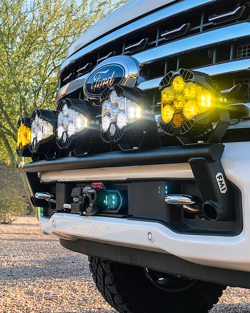2023 Ford F-250 Super Duty front light mount kit installed on stock bumper, showcasing multiple off-road lights.