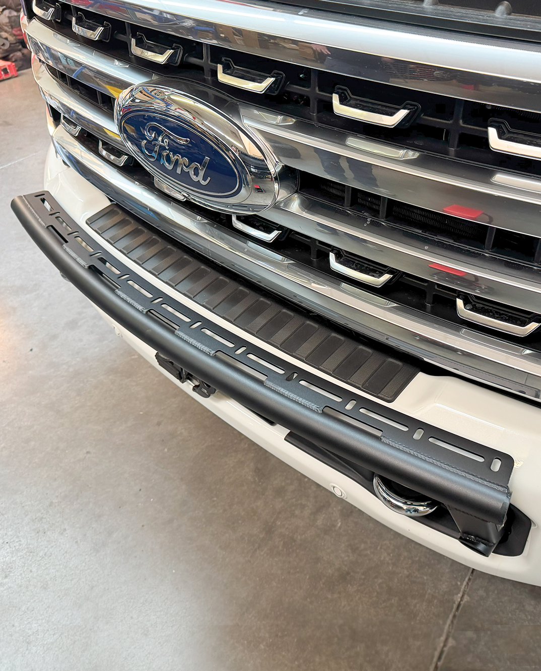 Front light mount kit for 2023+ Ford F-250 Super Duty, designed for stock bumpers, showcasing durable construction and sleek design.