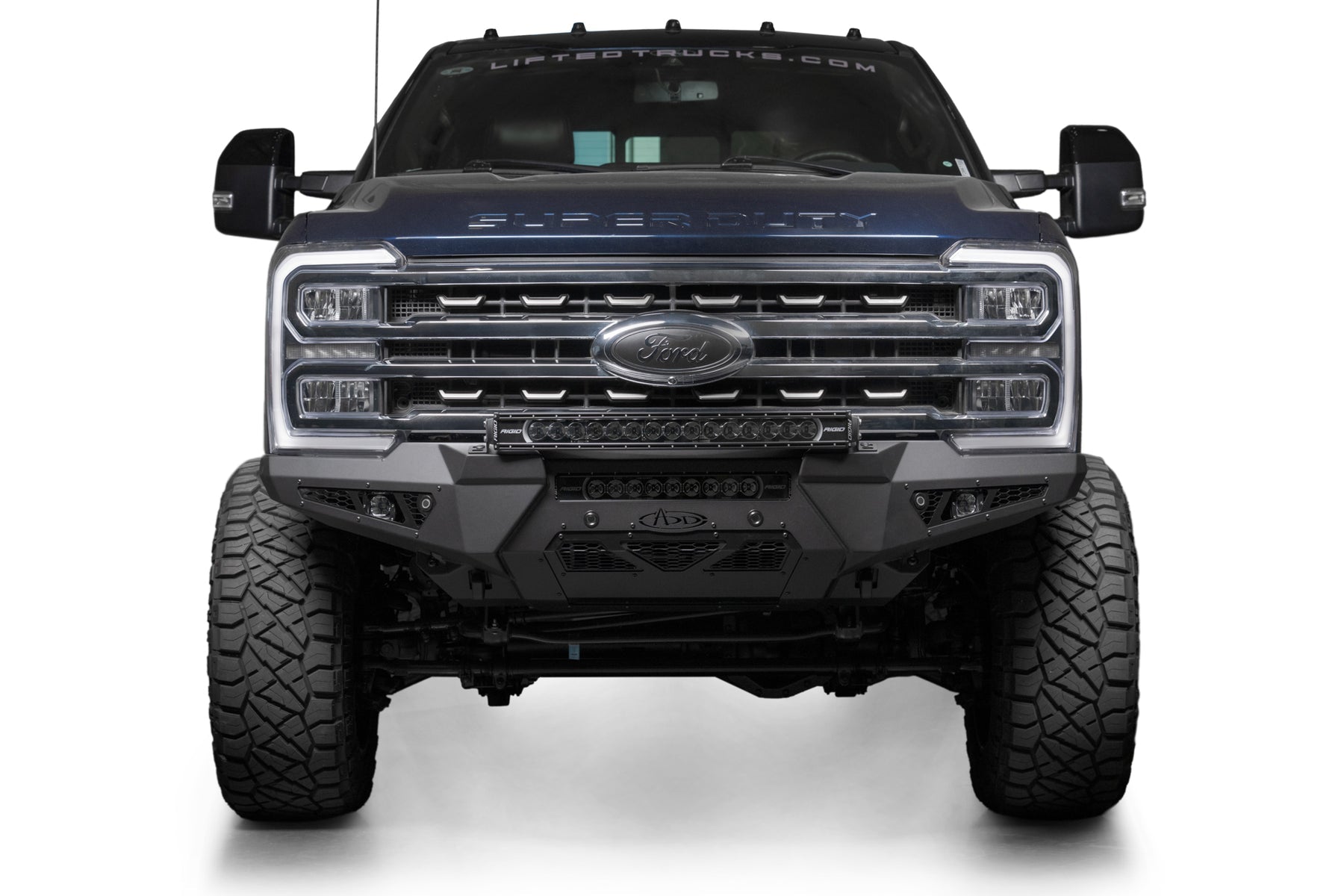 Addictive Desert Designs 2023+ Ford Super Duty Honeybadger Front Bumper showcasing a rugged design for enhanced offroad performance.