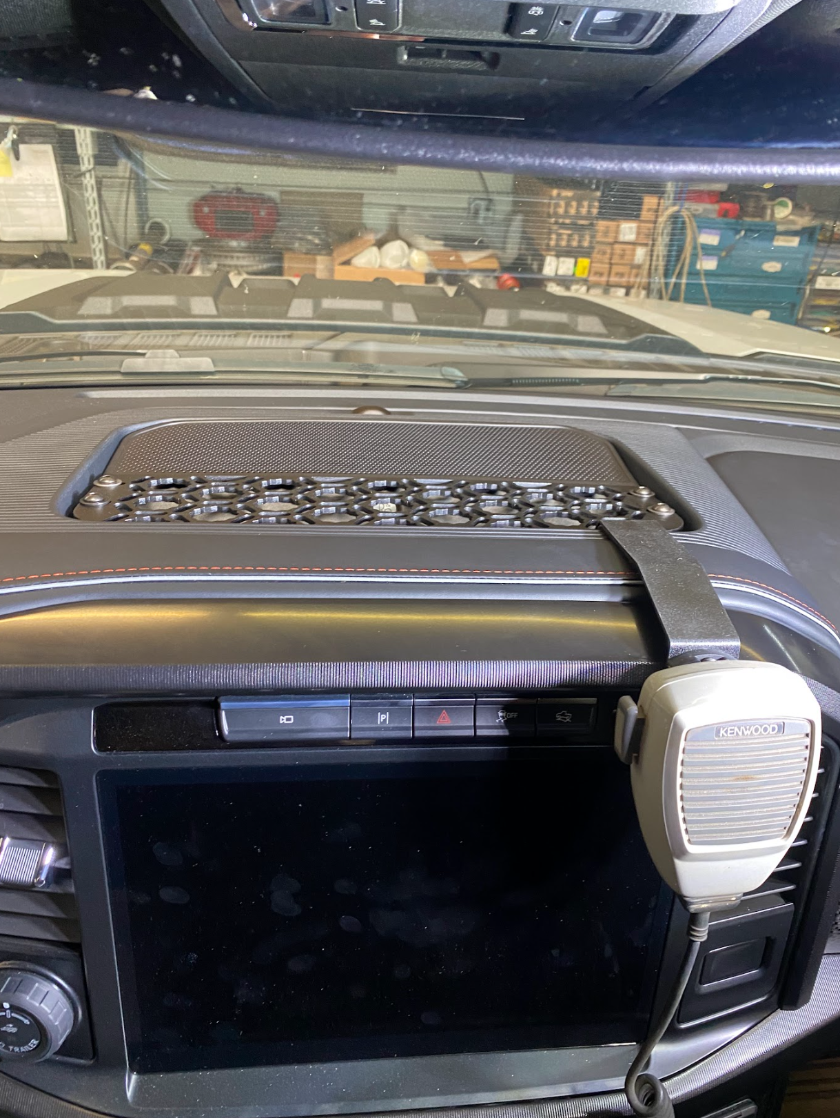 Center dash mount kit for 2024 F150 Raptor, featuring a textured surface and space for accessories, enhancing vehicle functionality.