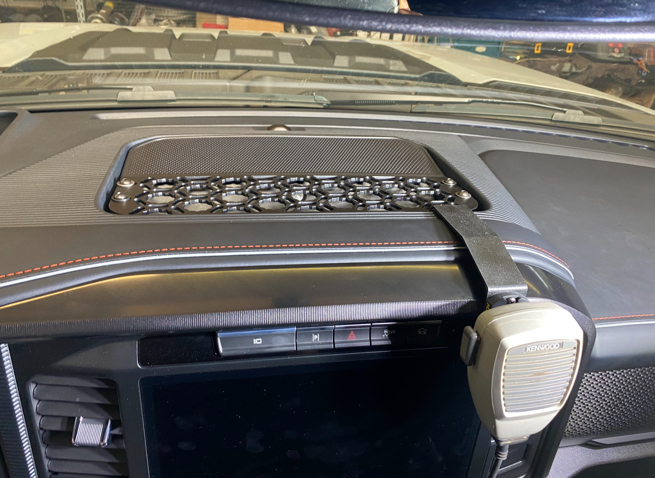 Center dash mount kit for 2024 F150 Raptor, featuring a textured surface and secure attachment for accessories.