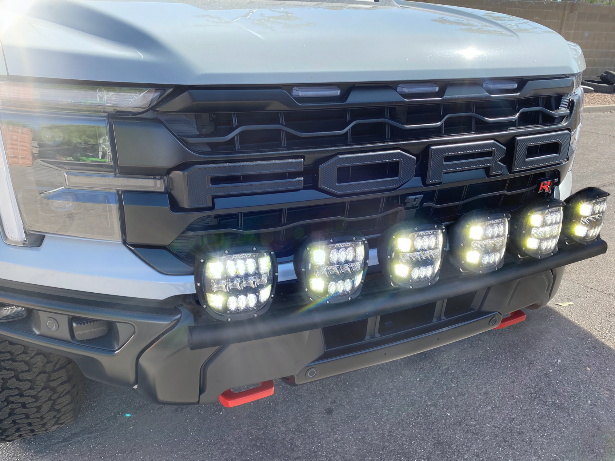 2024 Raptor Front Light Mount Kit on a Ford truck, showcasing multiple LED lights mounted on a modular bumper.
