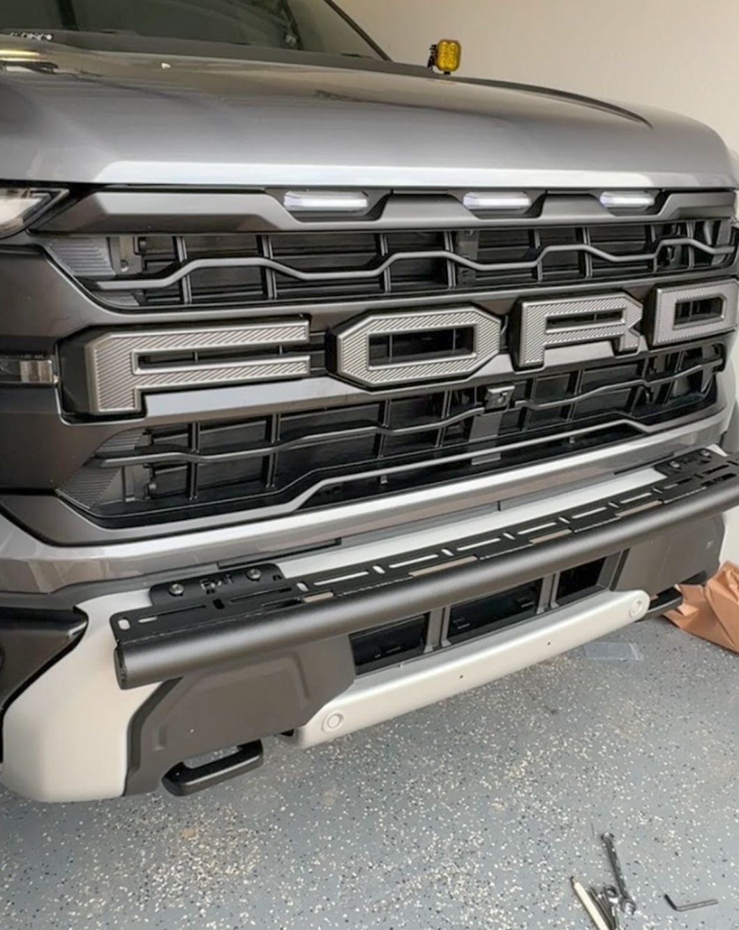 2024 Raptor front light mount kit installed on a modular bumper, designed for versatile light options.