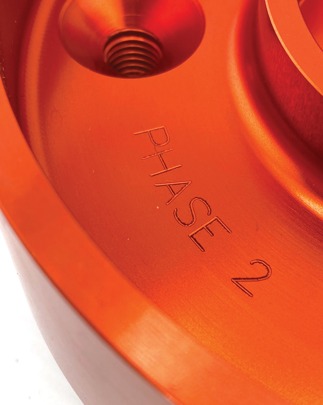 Billet top hat for 2024-Up Raptor with 1.5-inch lift for stock shock, featuring Phase 2 engraving. Ideal for offroad upgrades.