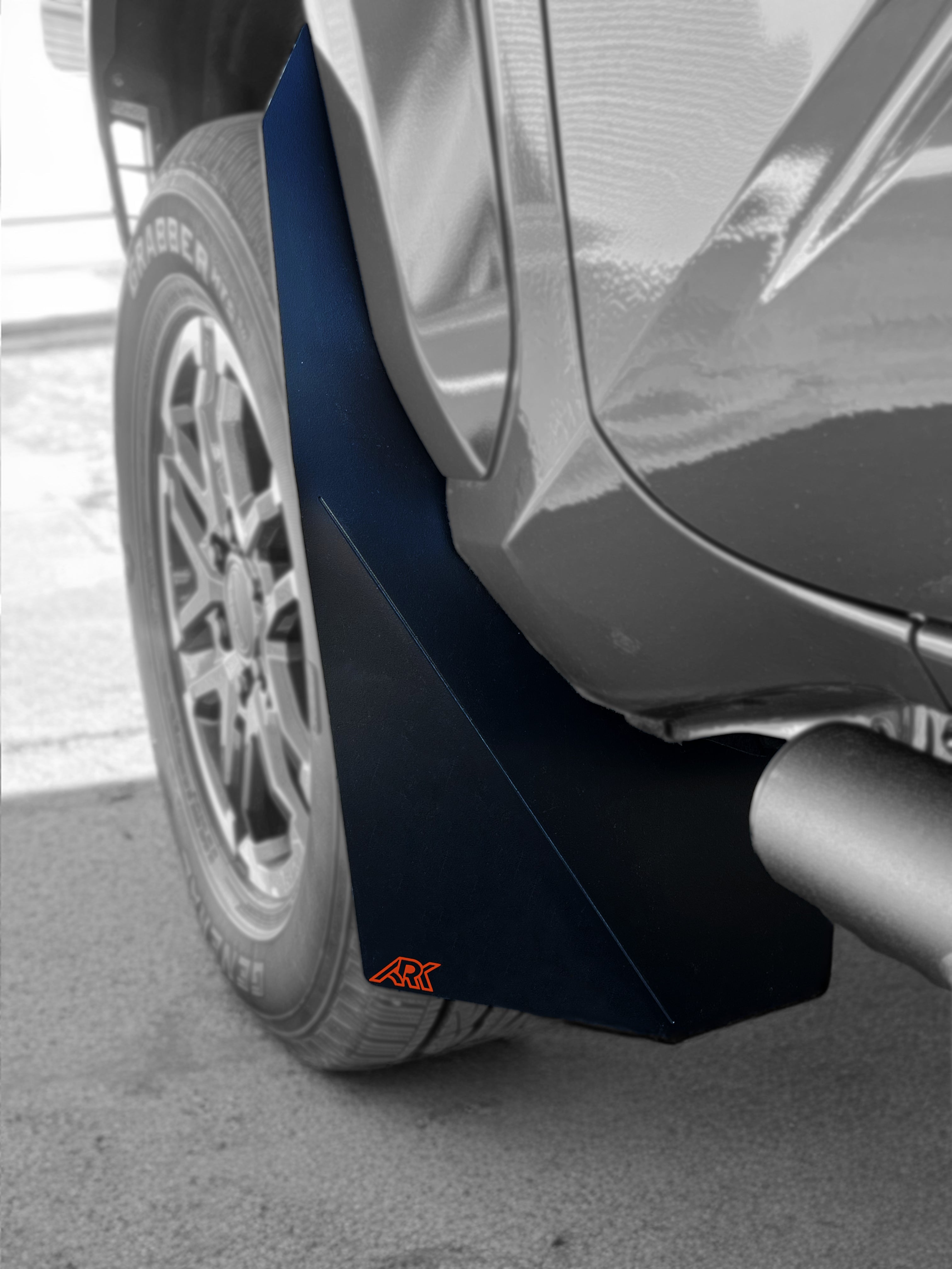 2024+ Toyota Tacoma TriXpoly splash guards and mudflap micros installed on a truck, providing protection from mud and debris.