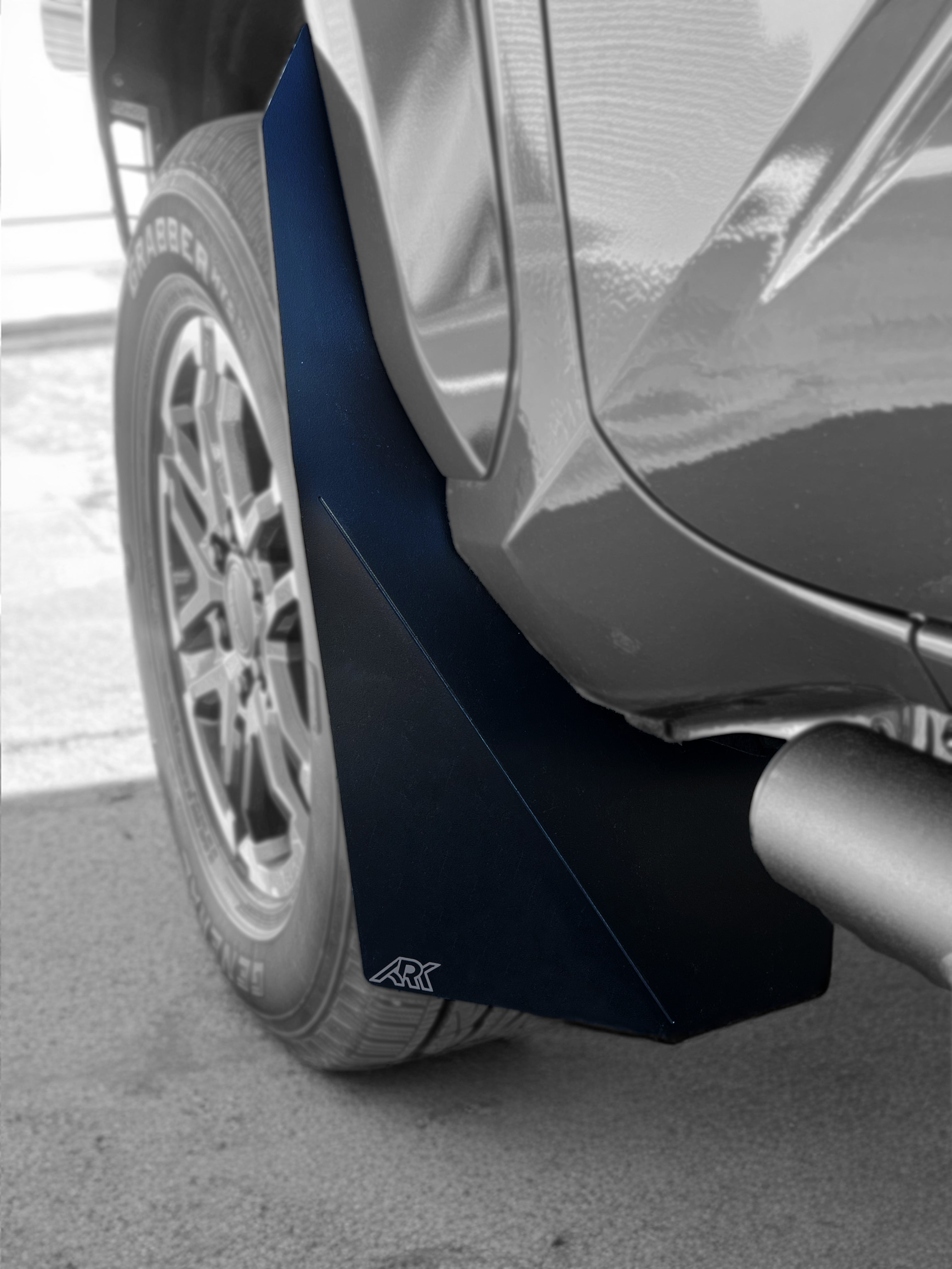 2024+ Toyota Tacoma TriXpoly splash guards and mudflap micros installed on a truck, providing protection from mud and debris.