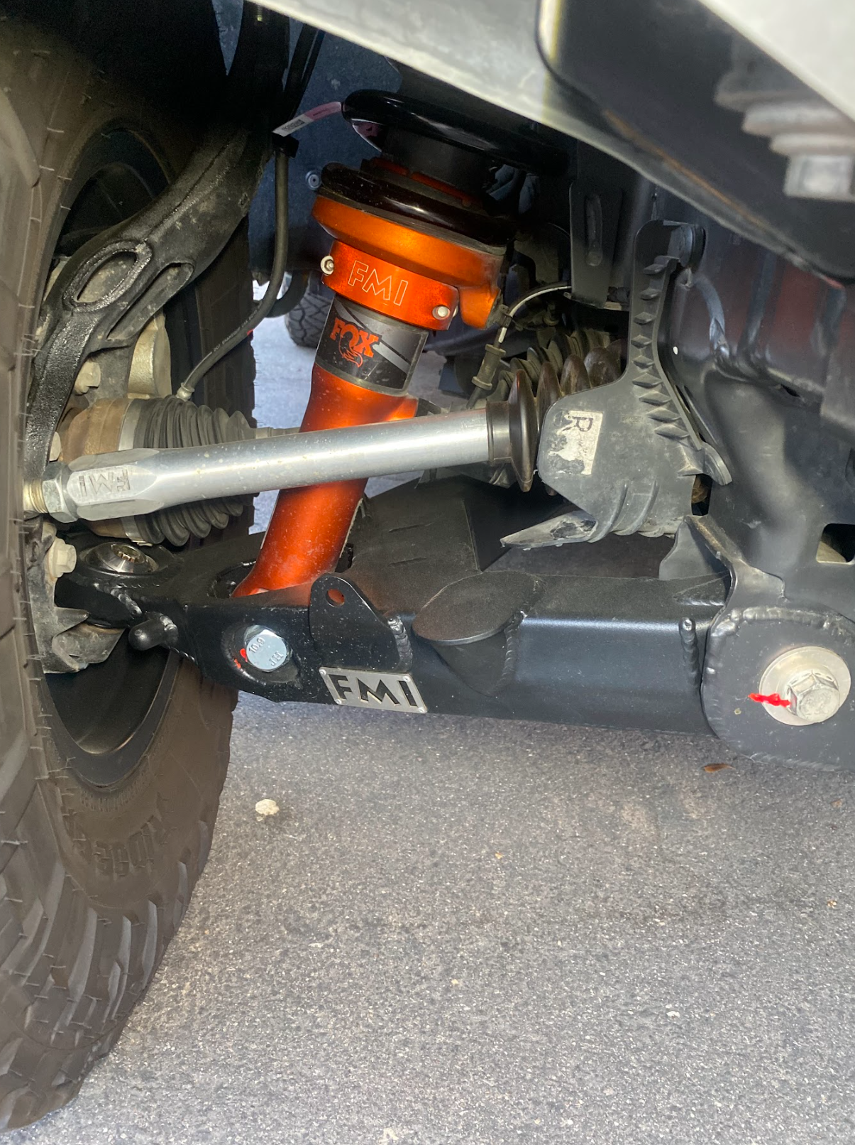 2024 Ranger Raptor fabricated lower A-arm kit showing stock width suspension components and shock absorber.