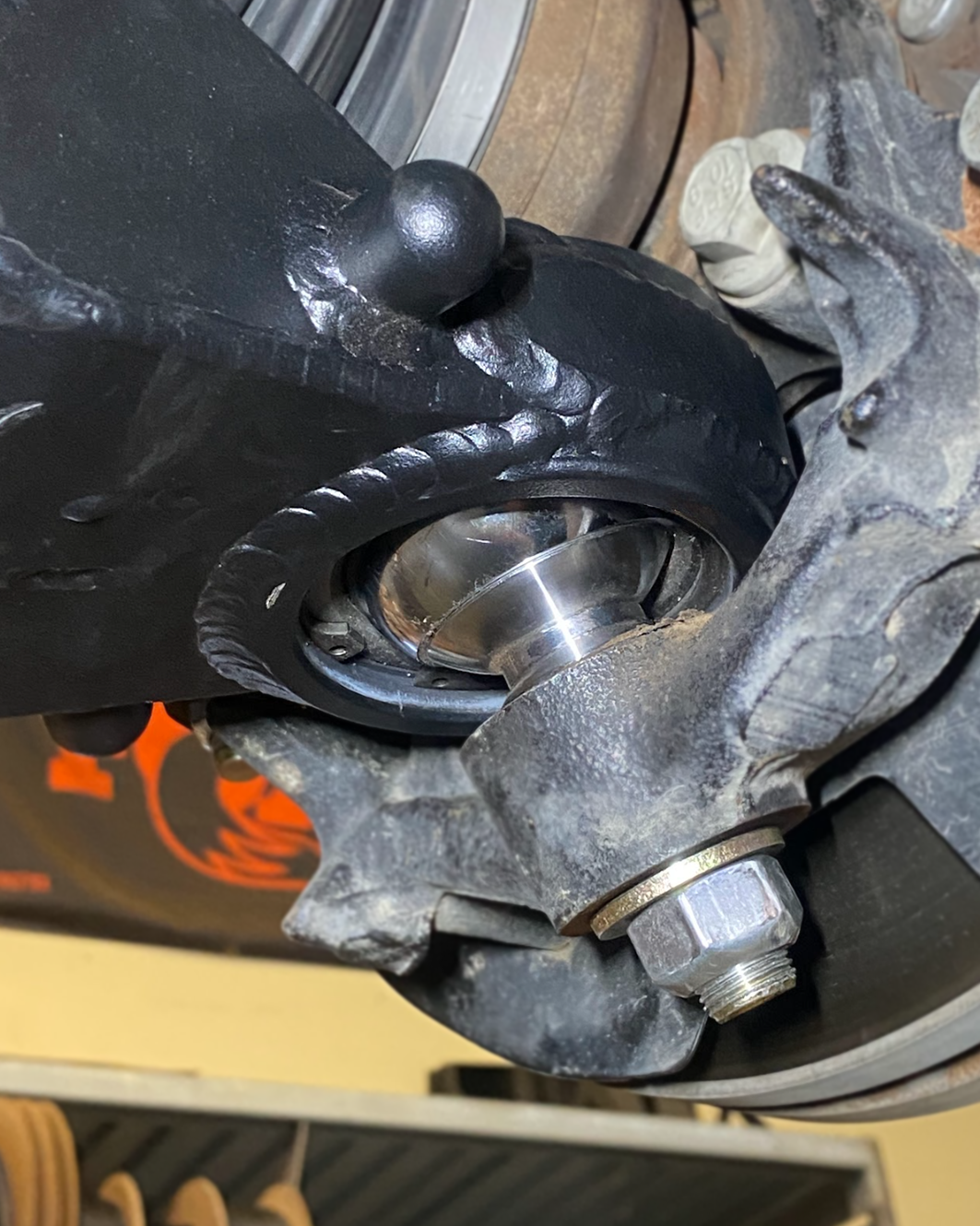 2024+ Ranger Raptor fabricated lower A-arm kit showing detailed construction and installation on a vehicle suspension system.