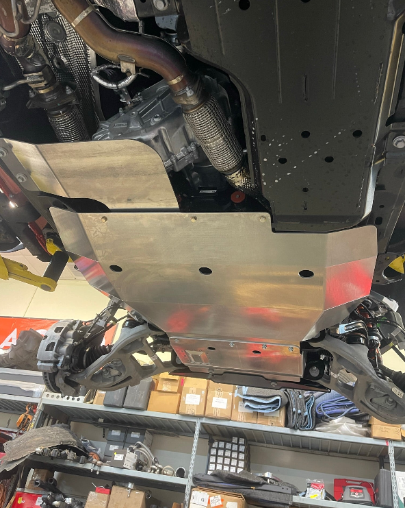 2024 Ford Ranger Raptor skid plate showcasing durable metal construction for underbody protection in offroad conditions.