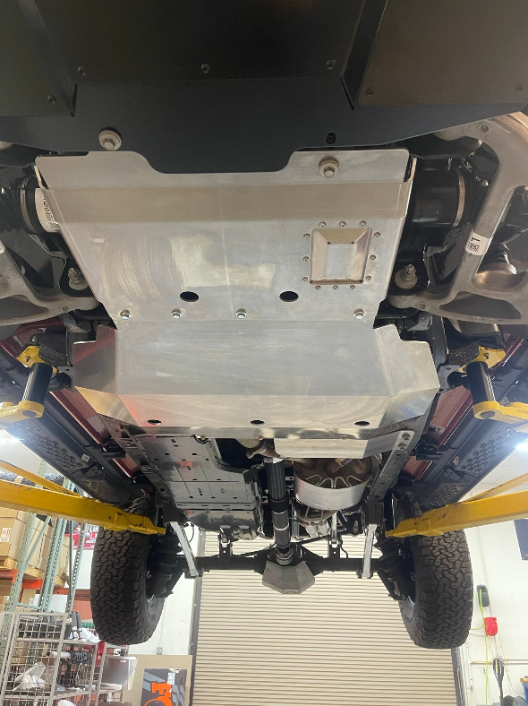 Aluminum skid plate installed on a 2024 Ford Ranger Raptor, providing undercarriage protection for off-road use.