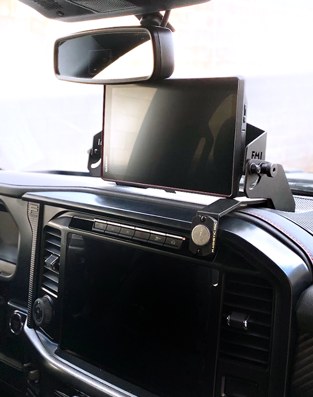 Center dash fold-down GPS mount for 2024+ Gen 3.5 Raptor, designed for Garmin TREAD XL, showcasing a sleek installation.