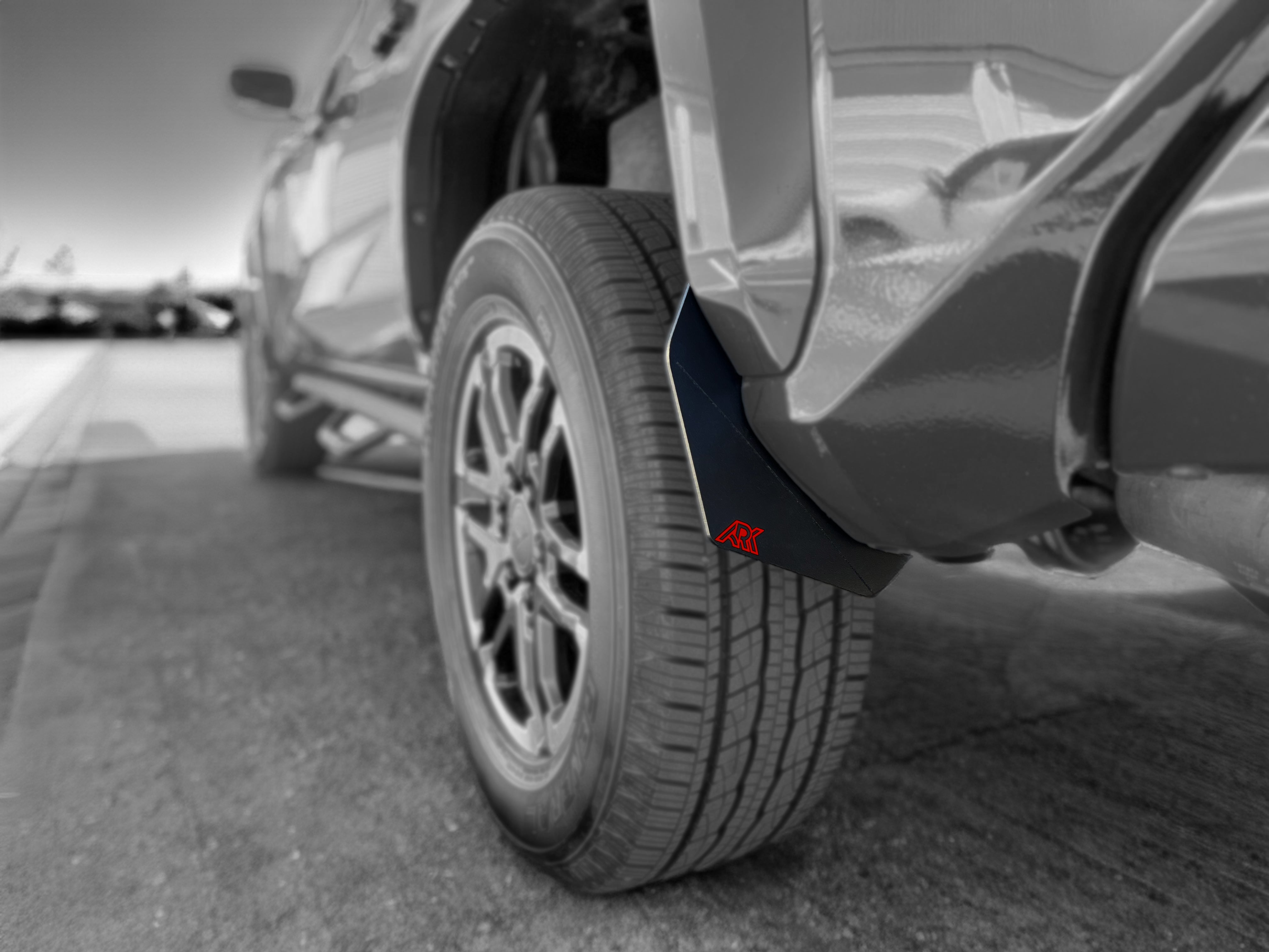 2024+ Toyota Tacoma TriXpoly splash guards and mudflap micros installed on a tire, providing protection from mud and debris.