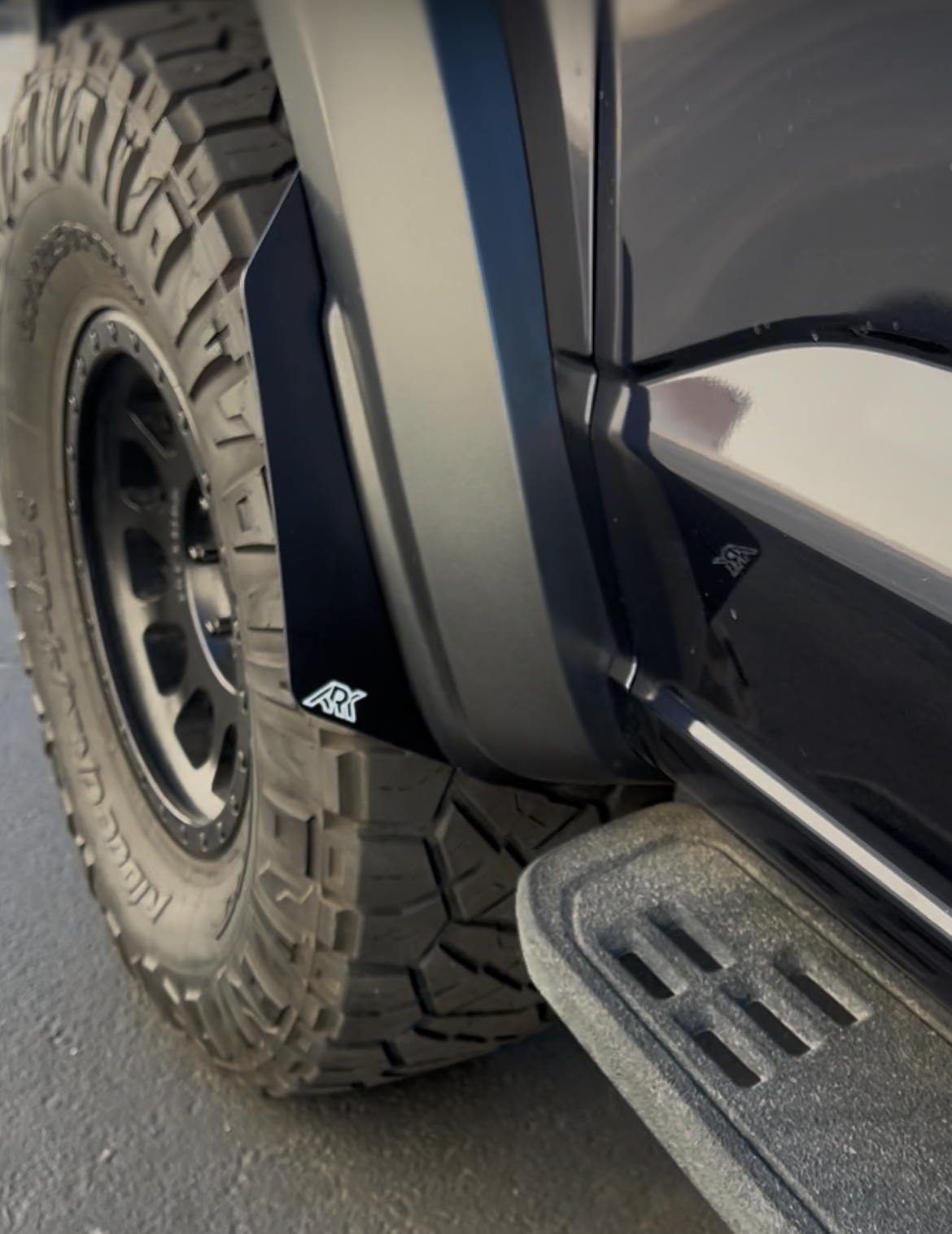 2021+ Ford Raptor Micro Flares showcasing a sleek design on a rugged tire, enhancing off-road performance and style.