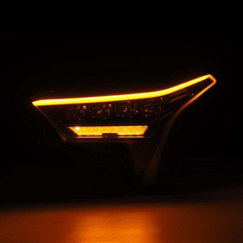 AlphaRex NOVA-Series black headlights for 2022-2023 Toyota Tundra with white DRL and amber turn signal.
