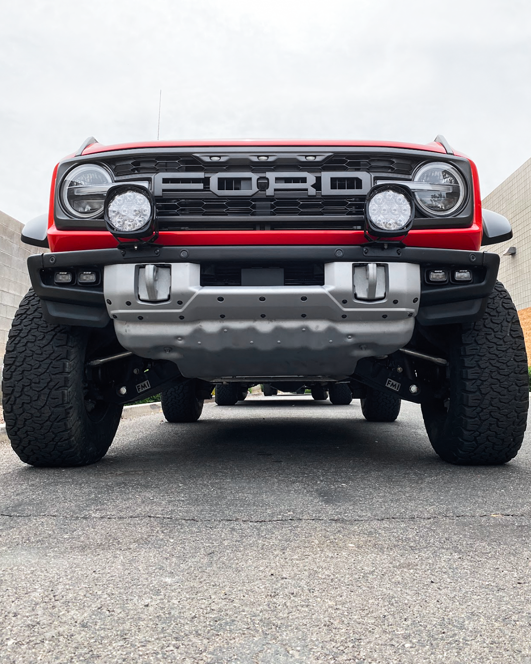 Front view of a 2022-2024 Bronco Raptor showcasing light mount brackets installed on a stock modular bumper.