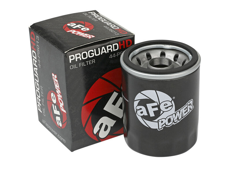 aFe PROGUARD oil filter displayed next to its packaging, designed for enhanced engine protection and performance.