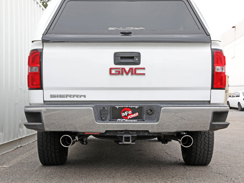 Rear view of a GMC Sierra truck featuring the aFe Apollo GT Series Cat-Back Exhaust System, showcasing dual exhaust tips.
