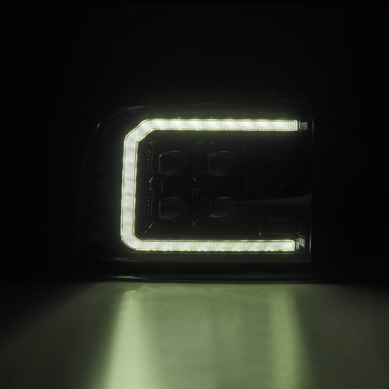 AlphaRex NOVA-Series LED projector headlights for 05-07 Ford Super Duty/Excursion in black with activated lighting.