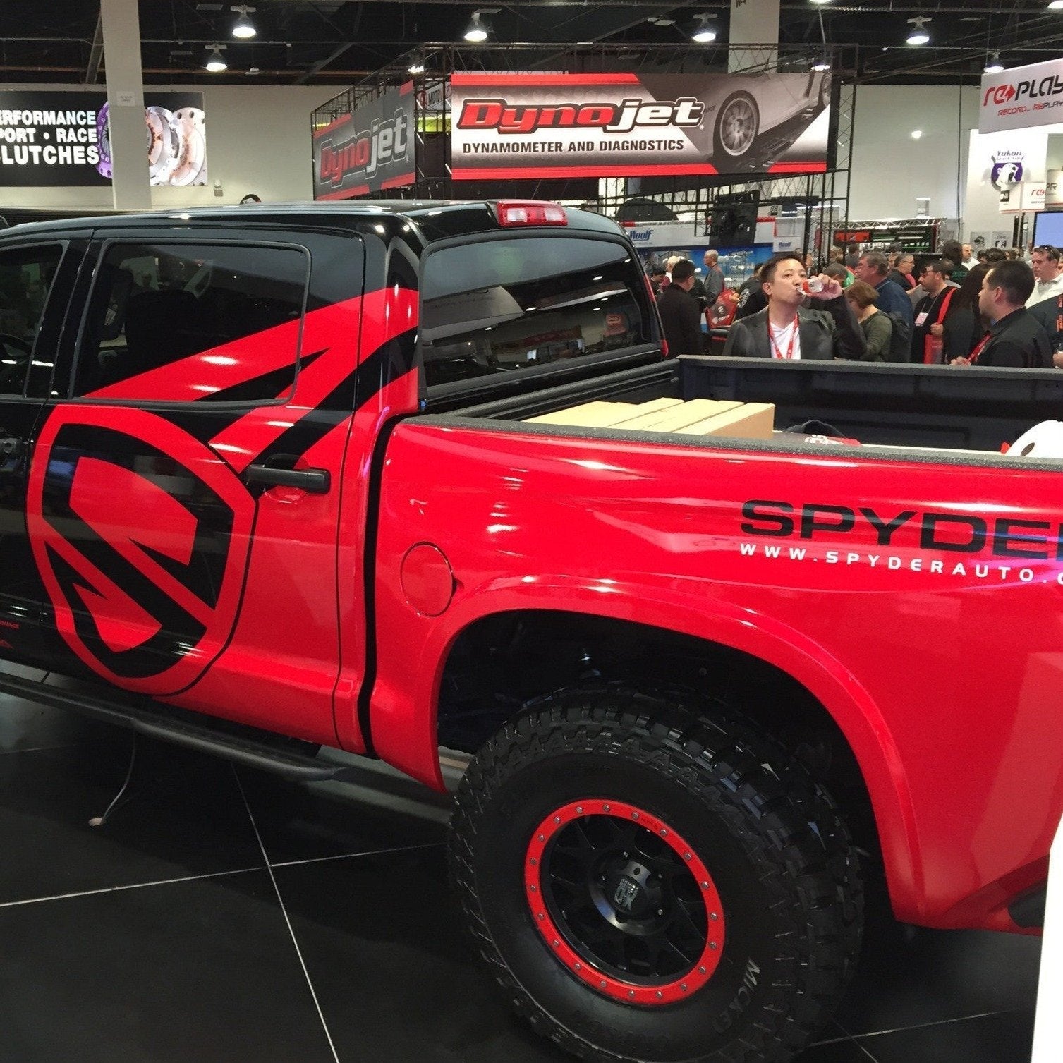 2014-2021 Toyota Tundra bedsides showcased on a modified truck at an automotive event, highlighting offroad customization.