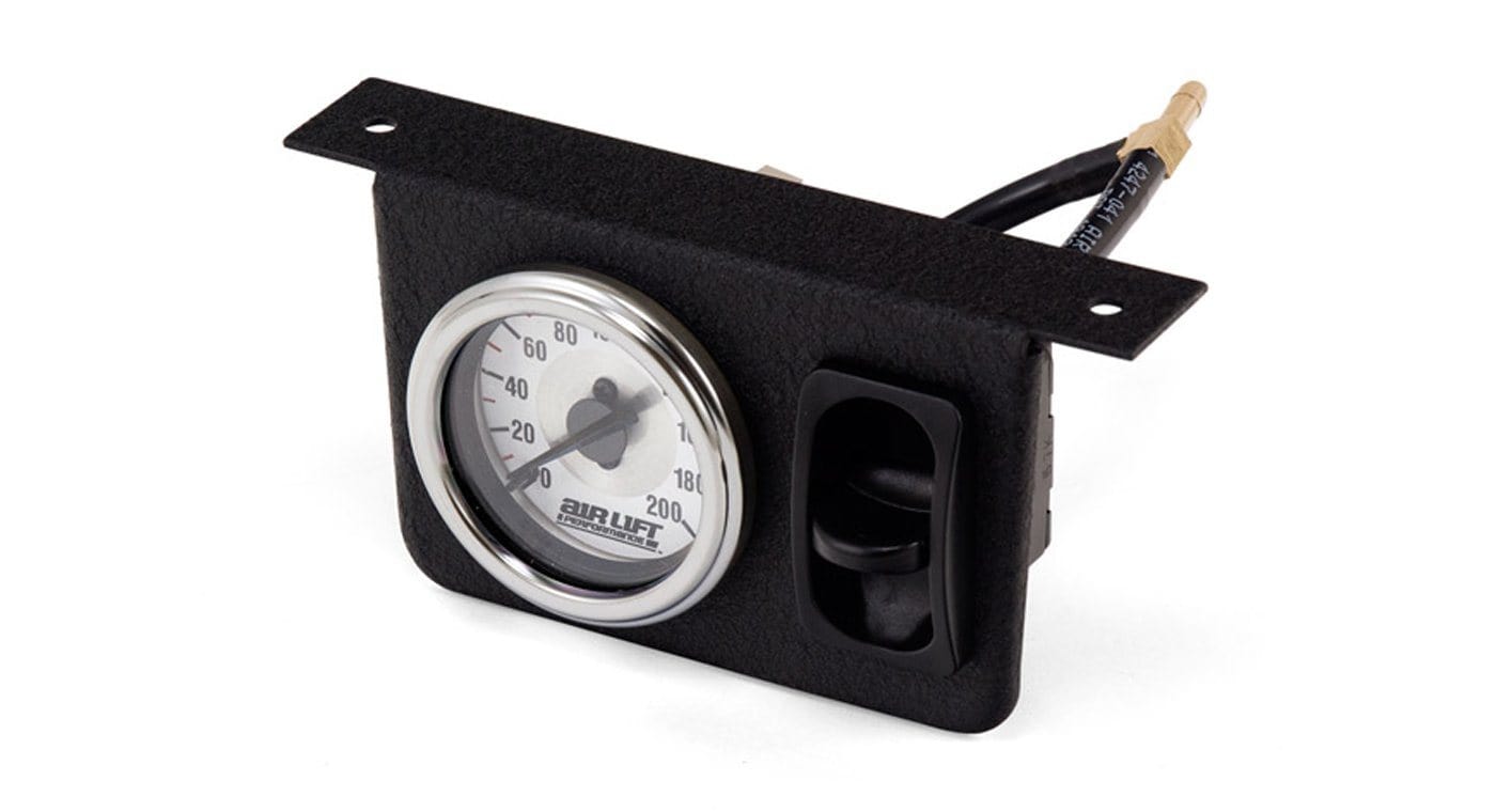 Air Lift single needle gauge panel with paddle switch for monitoring air pressure in vehicles. Durable design for easy installation.