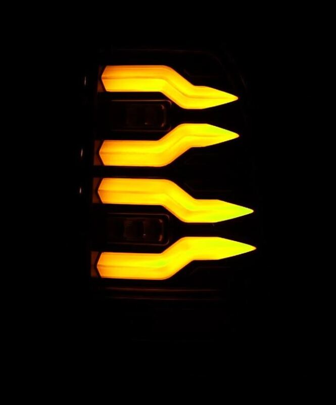 AlphaRex LUXX-Series LED tail lights for 97-03 Ford F150 and 99-16 Ford Super Duty in Alpha-Black with illuminated design.