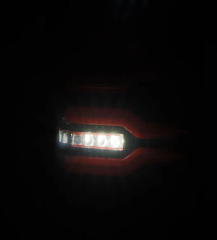 AlphaRex LUXX-Series LED tail lights for 99-06 Chevrolet Silverado and GMC Sierra in black and red design.