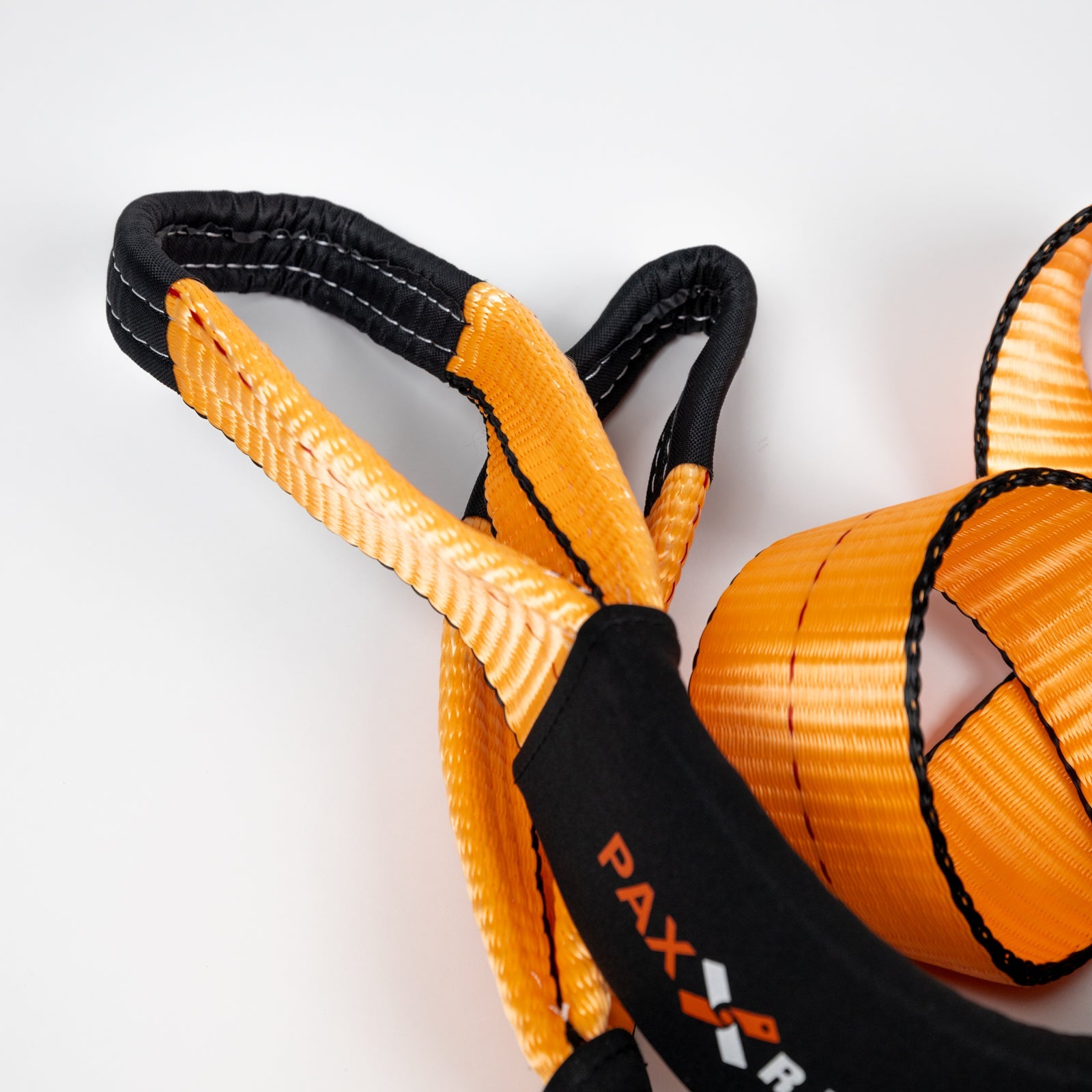 30-foot flat strap with durable orange and black webbing, designed for towing and recovery applications.
