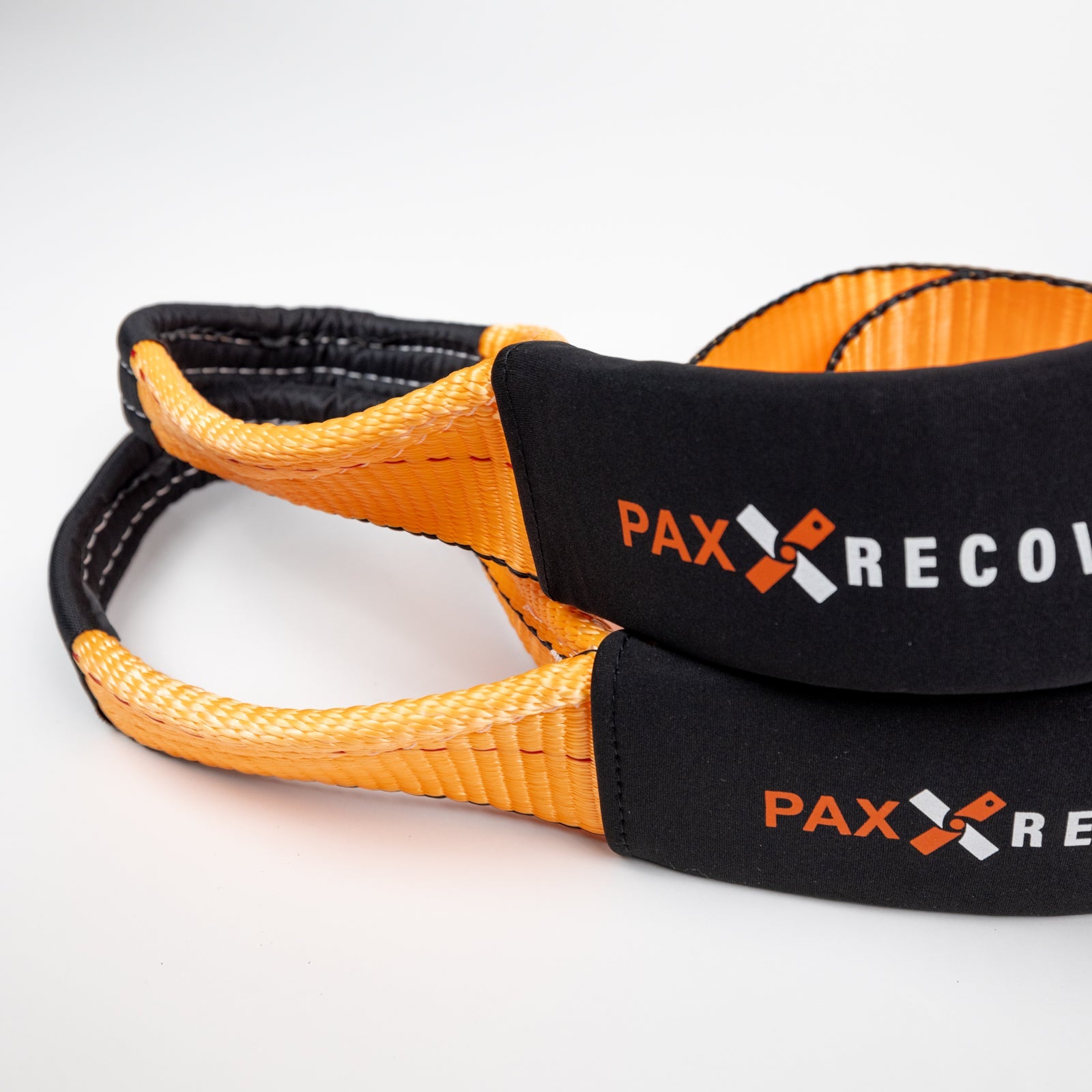 30-foot flat strap with durable orange webbing and padded handles, ideal for offroad recovery and towing applications.