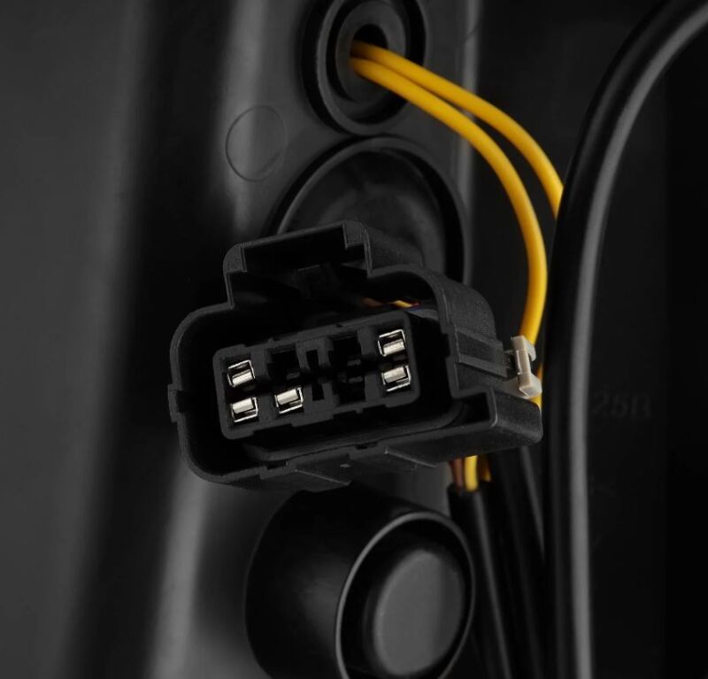 Close-up of the wiring harness for AlphaRex LUXX-Series LED tail lights for 99-06 Chevrolet Silverado and GMC Sierra.