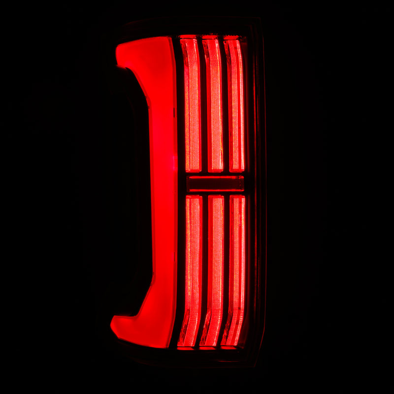 AlphaRex NOVA-Series LED prismatic tail light for 24-25 Toyota Tacoma in black and red, showcasing a sleek design.