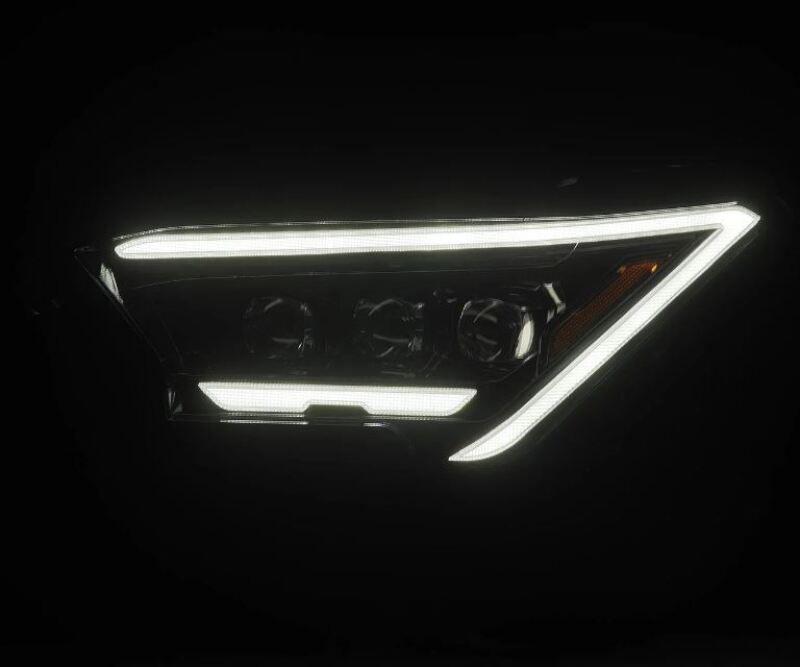 AlphaRex 2024 Toyota Tacoma NOVA-Series projector headlights in alpha-black with activation light, showcasing a sleek design.