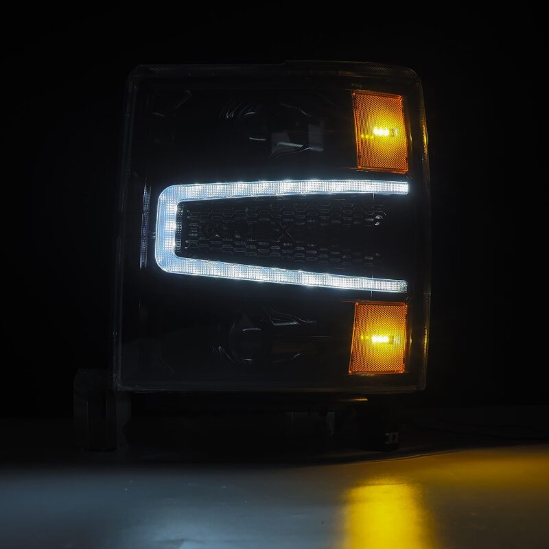 AlphaRex LUXX LED projector headlights for 04-15 Chevy 1500HD in black with sequential activation and signal lights.