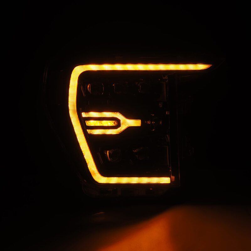 AlphaRex NOVA LED projector headlights for 2021-2022 Ford F-150 with plank style design and sequential signal lights.