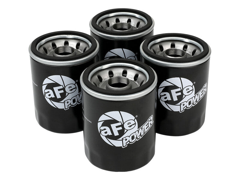Four aFe PROGUARD oil filters stacked together, featuring a black design with the aFe POWER logo prominently displayed.