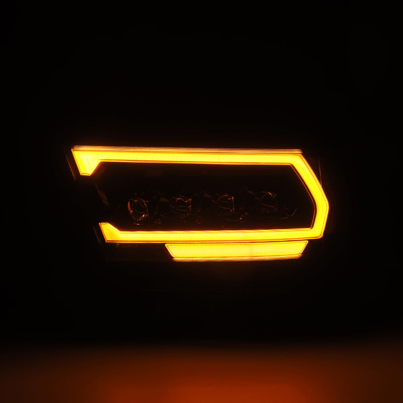 AlphaRex NOVA-Series LED projector headlights for 2019-2023 Dodge Ram 1500, featuring a sleek black design and bright amber accents.