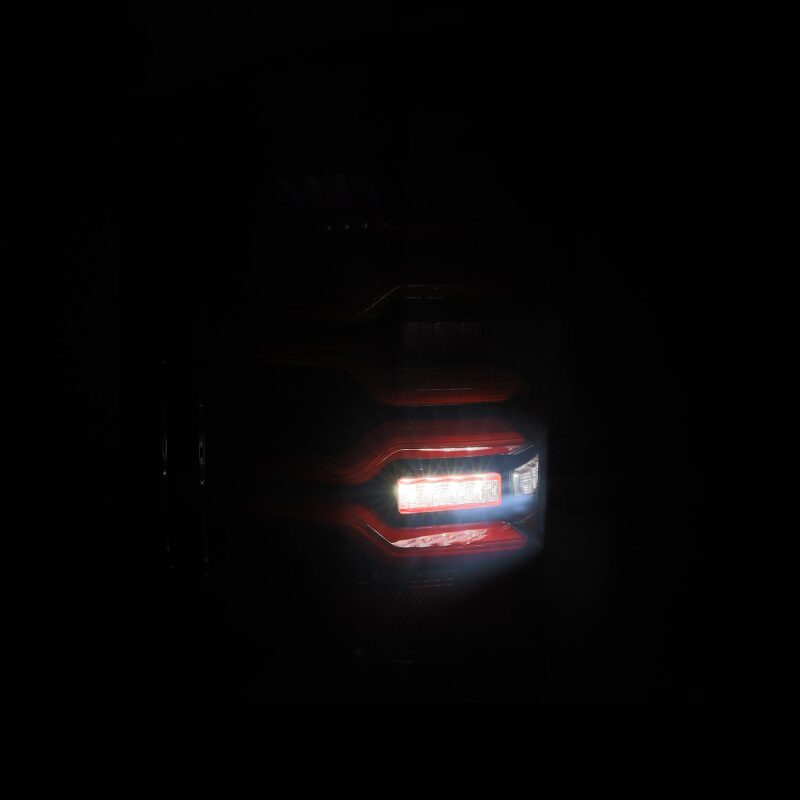 AlphaRex Luxx-Series LED tail lights for 14-18 Chevy Silverado 1500 in black and red with sequential signals.