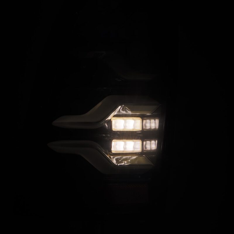 AlphaRex LUXX LED taillights for 05-15 Toyota Tacoma in black with sequential signal and active light feature.