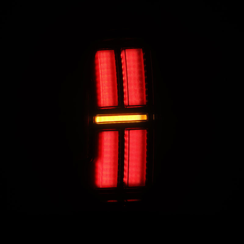 AlphaRex NOVA LED tail lights for 2005-2015 Toyota Tacoma in black, showcasing bright red and amber lighting design.