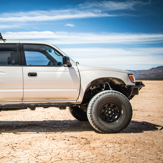 1996-2002 Toyota 4-Runner fenders displayed on an off-road vehicle in a rugged outdoor setting.