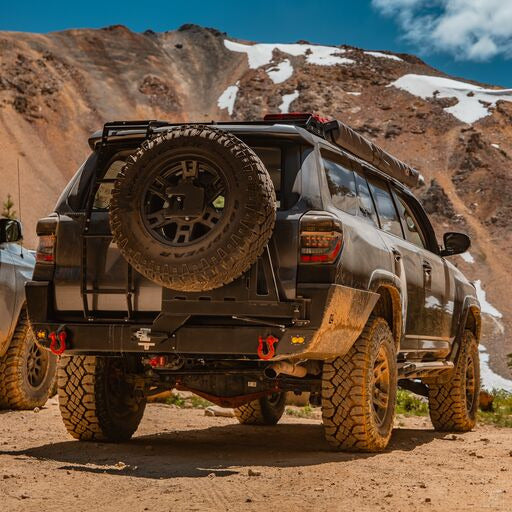 4Runner Overland Series Rear Bumper for 2010-2024 models, showcasing rugged design and off-road capability in a scenic landscape.