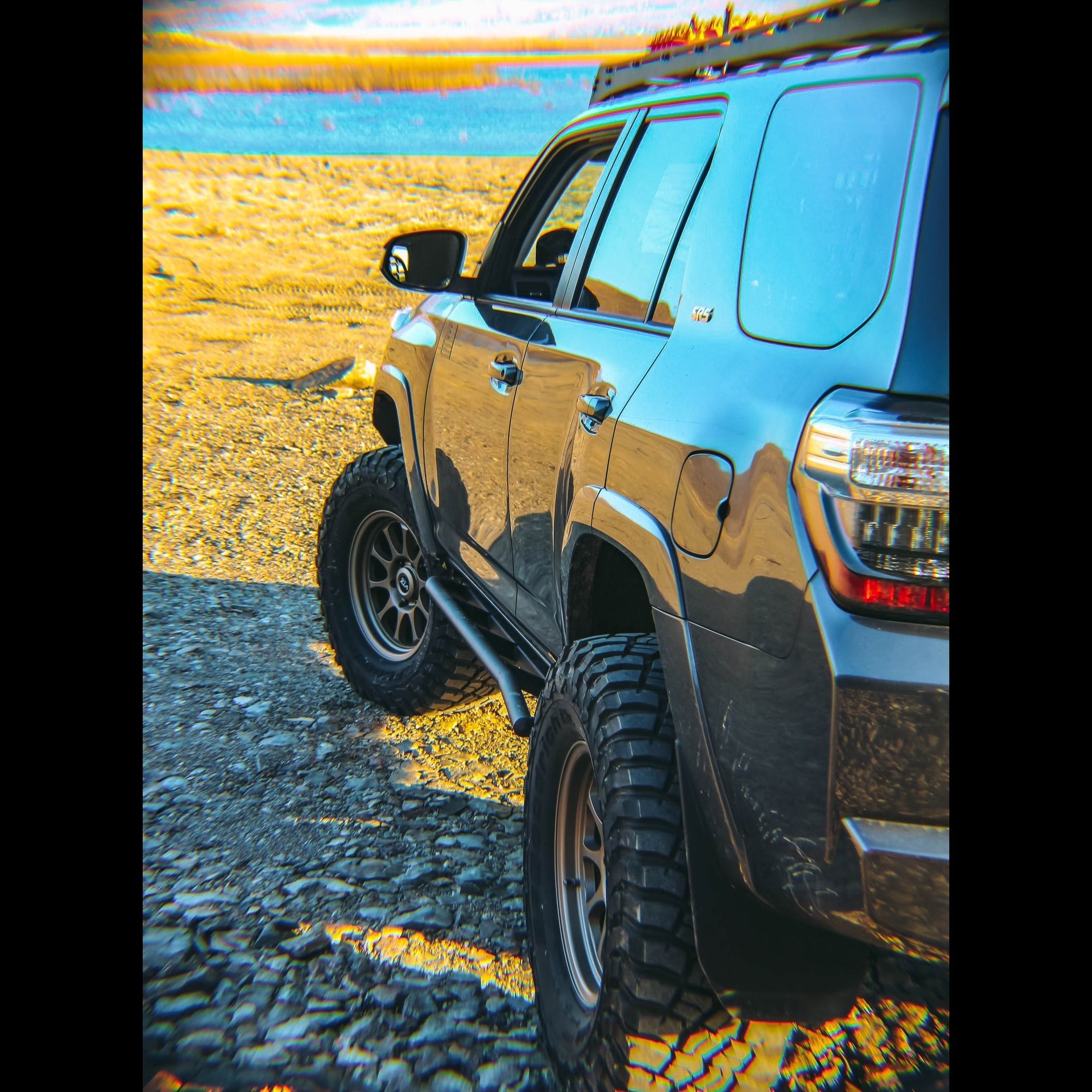 4Runner rock sliders for 5th Gen models (2010-2013) enhancing off-road protection and style on rugged terrain.