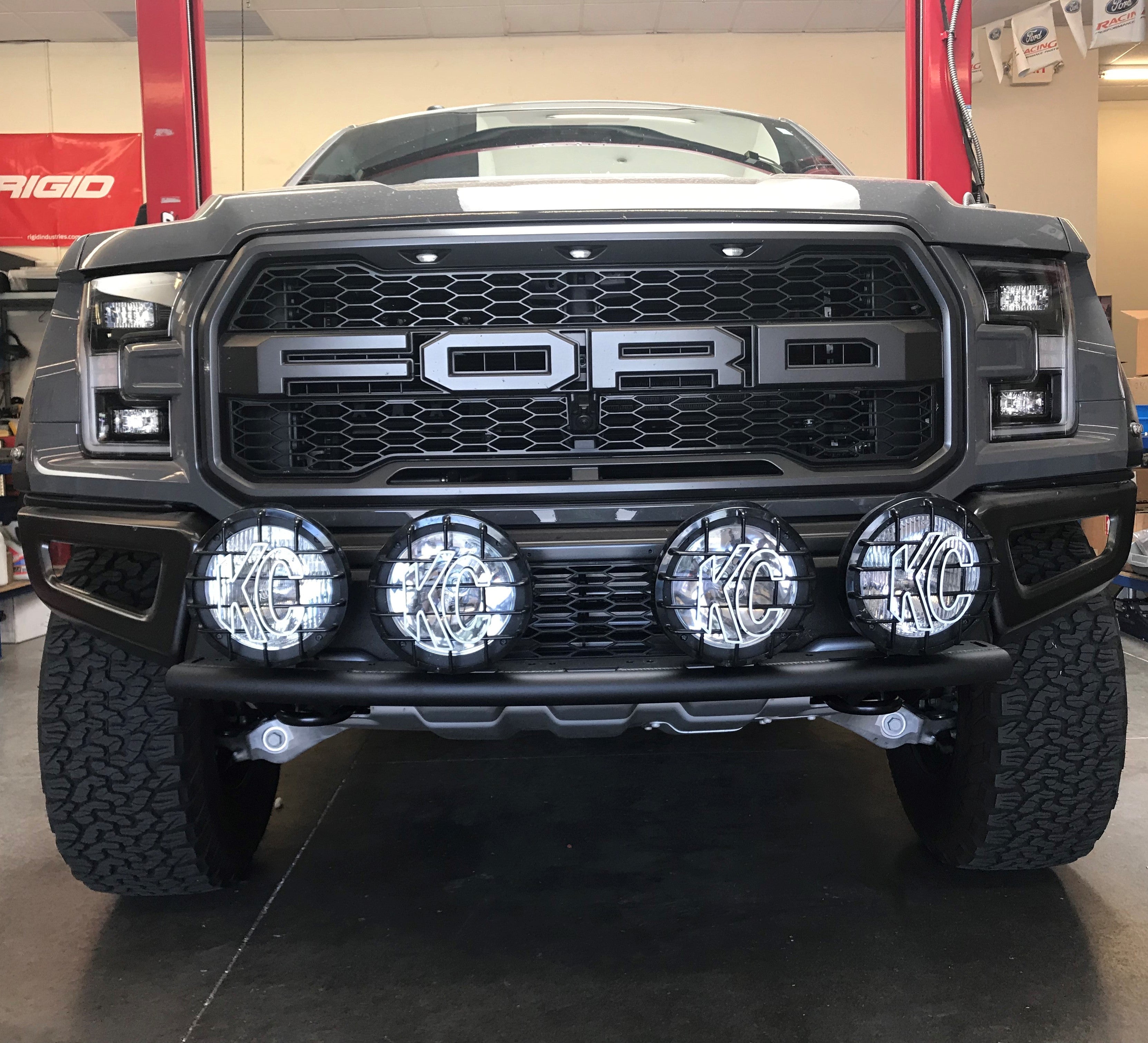 Single tube light mount for 2015+ F150 and 2017+ Raptor, featuring four mounted lights on a stock bumper.